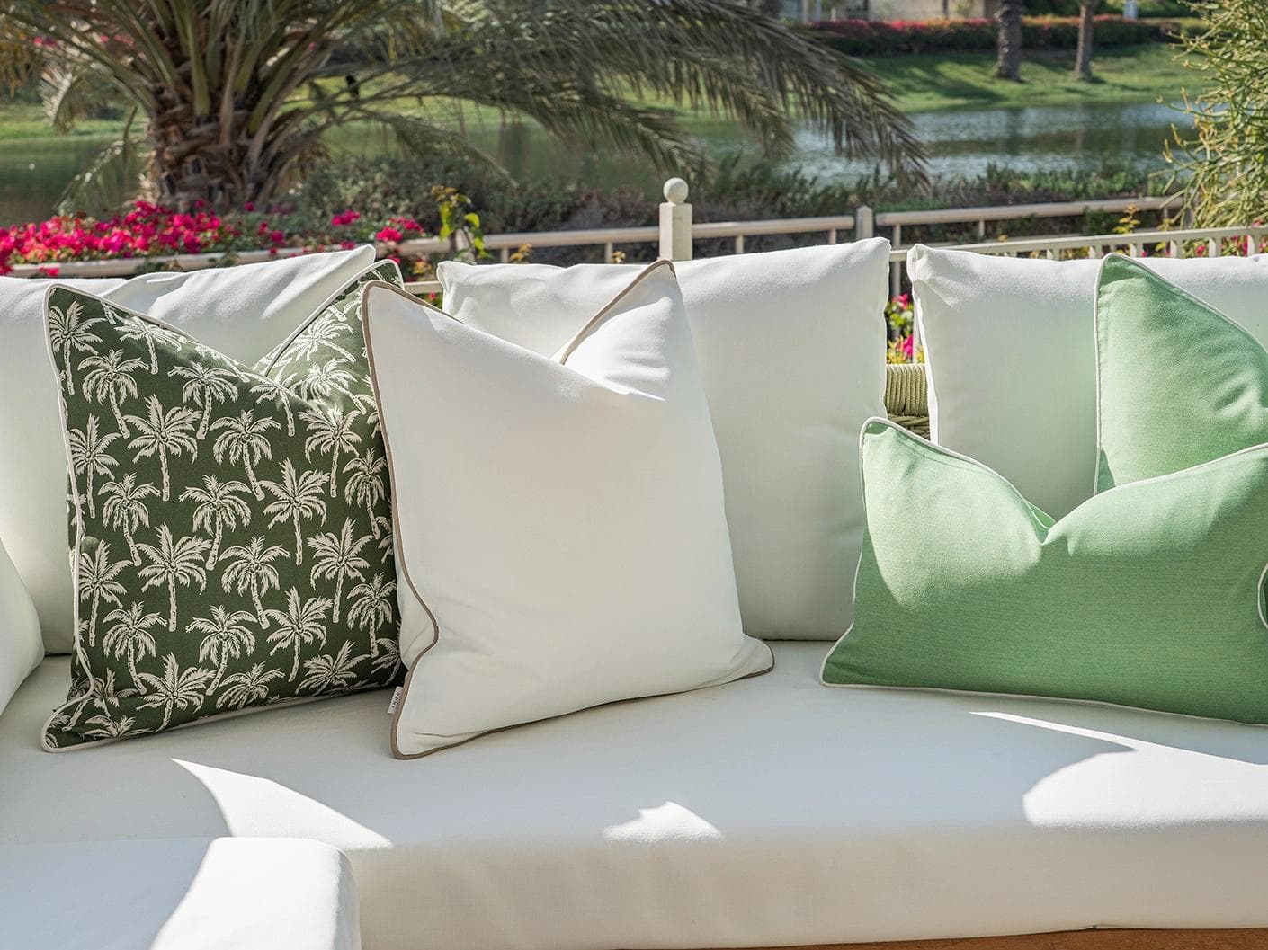 Keyla Bundle cushion in green and ivory, shown in a lifestyle left view as image 5
