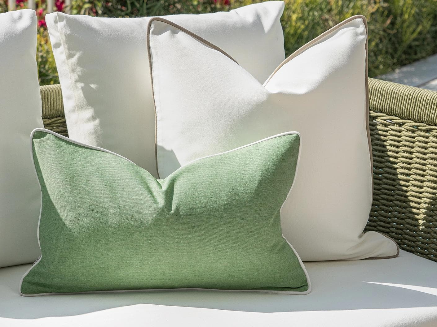 Keyla Bundle cushion in green and ivory, shown in a lifestyle left view as image 6