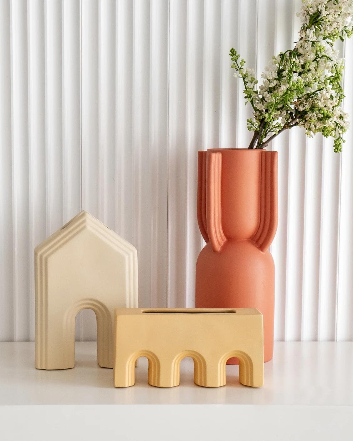 Klara Arneson vases in beige and orange, shown in a lifestyle front view as image 5