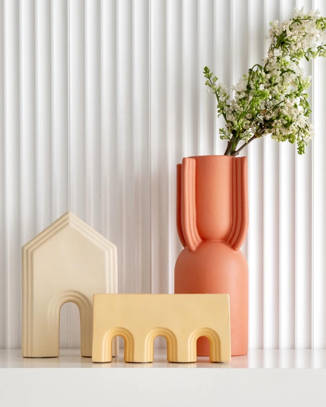 Klara Arneson vases in beige and orange, shown in a lifestyle front view as image 4