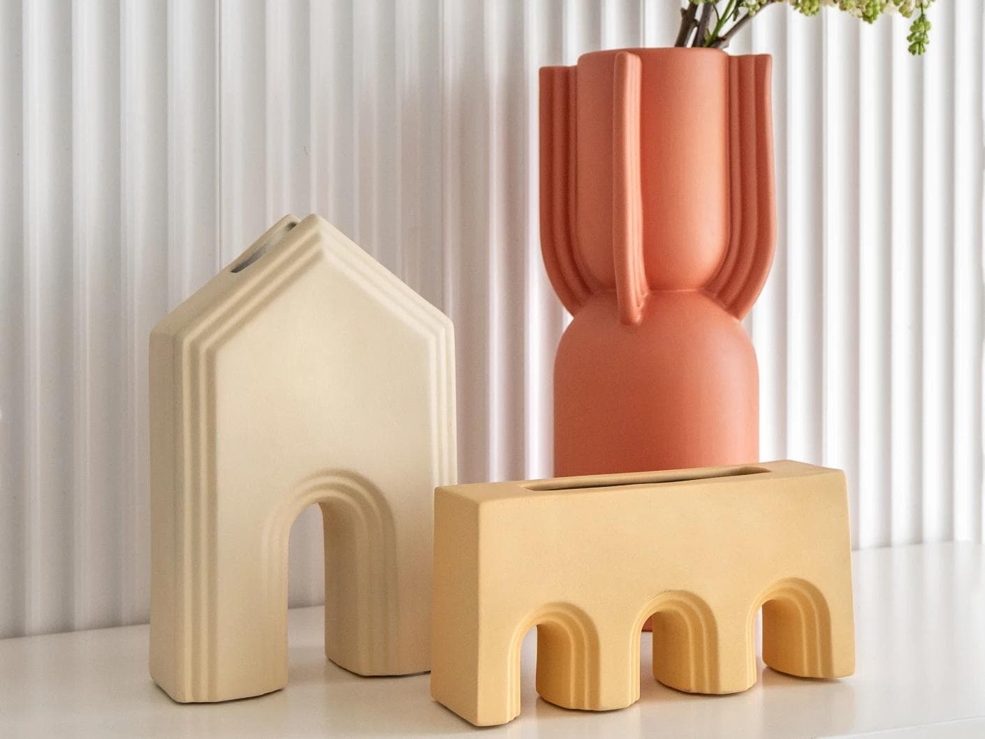 Klara Arneson vases in beige and orange, shown in a lifestyle front view as image 2