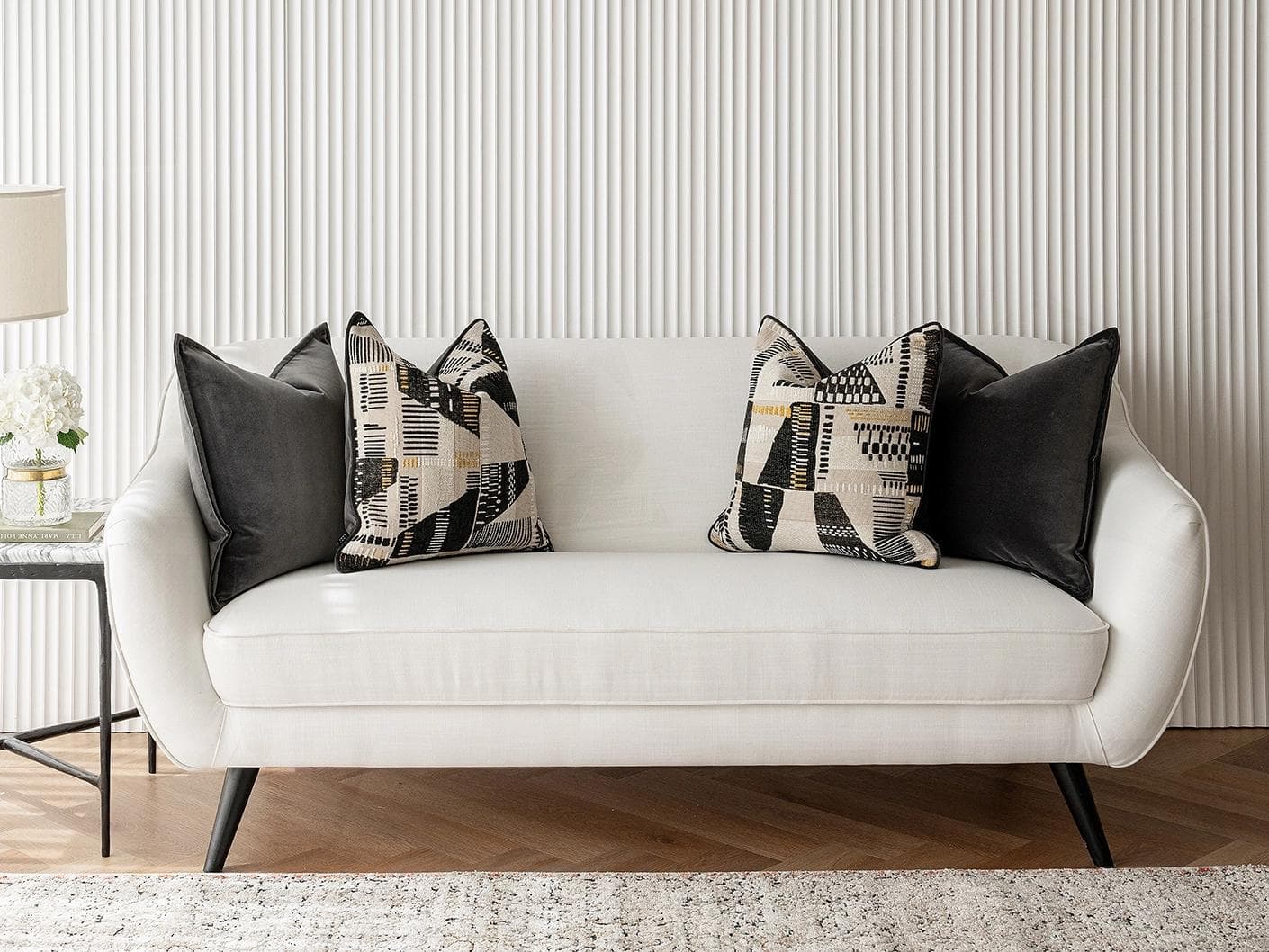 Krishna Bundle cushion in black, grey and beige, shown in a lifestyle front view as image 4