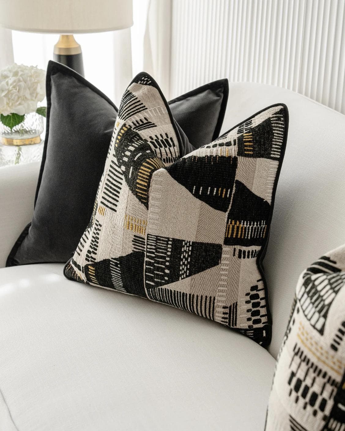 Krishna Bundle cushion in black, grey and beige, shown in a lifestyle right view as image 5