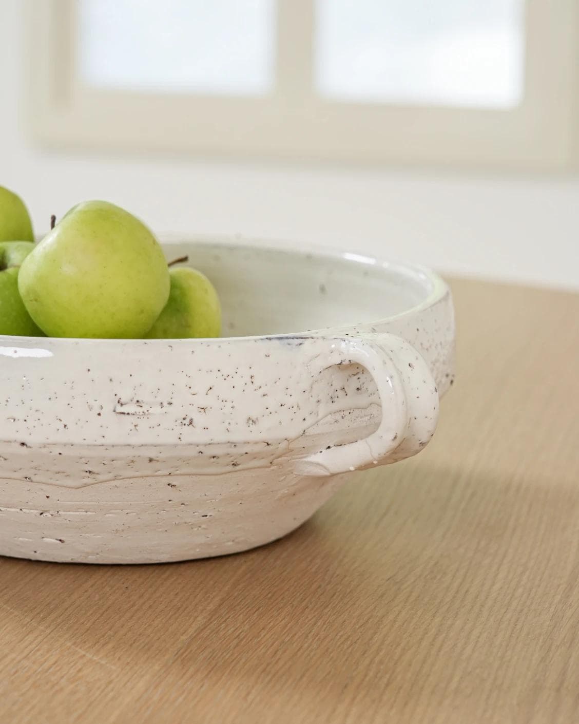 Kyan Terra bowls in soft stone and white, shown in a lifestyle close-up as image 4