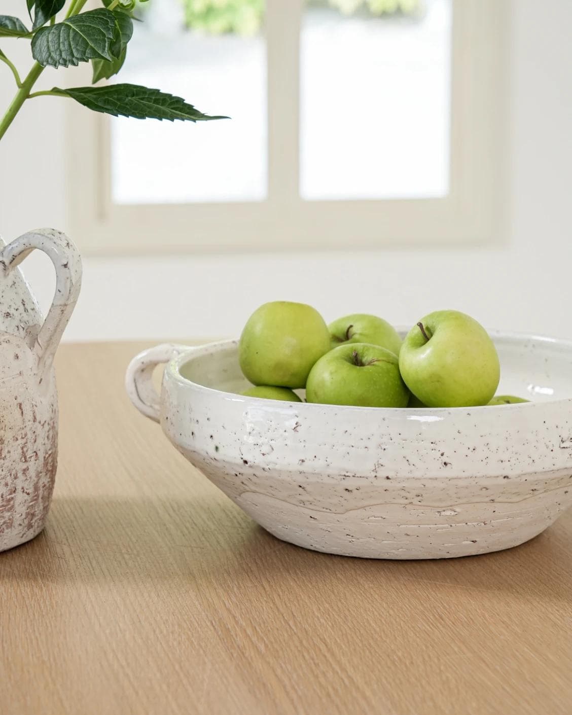 Kyan Terra bowls in soft stone and white, shown in a lifestyle front view as image 5