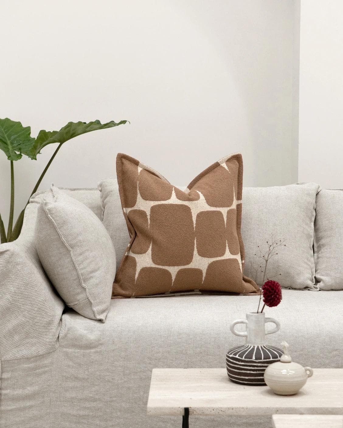Kyomi Braun cushion in brown, shown in a lifestyle front view as image 4
