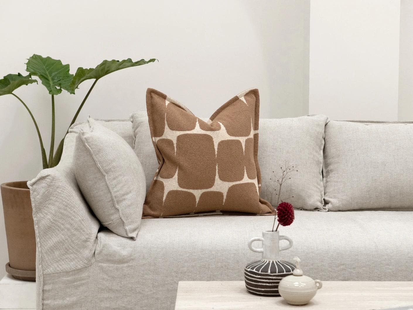 Kyomi Braun cushion in brown, shown in a lifestyle front view as image 4