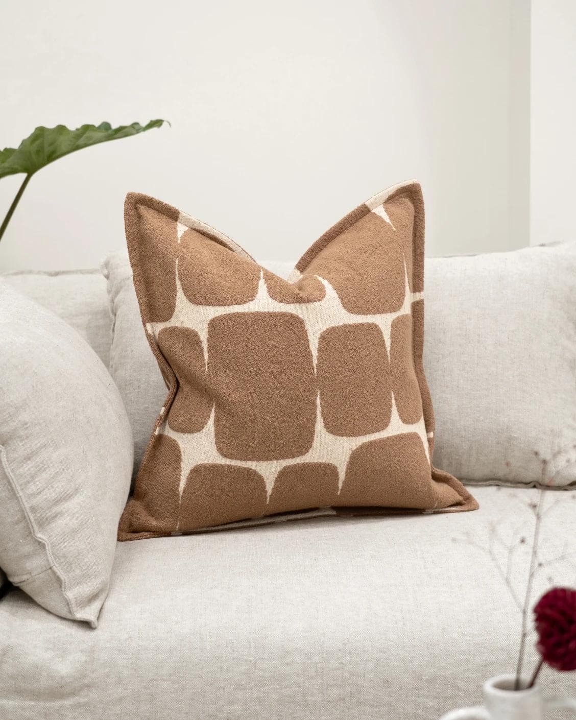 Kyomi Braun cushion in brown, shown in a lifestyle front view as image 2