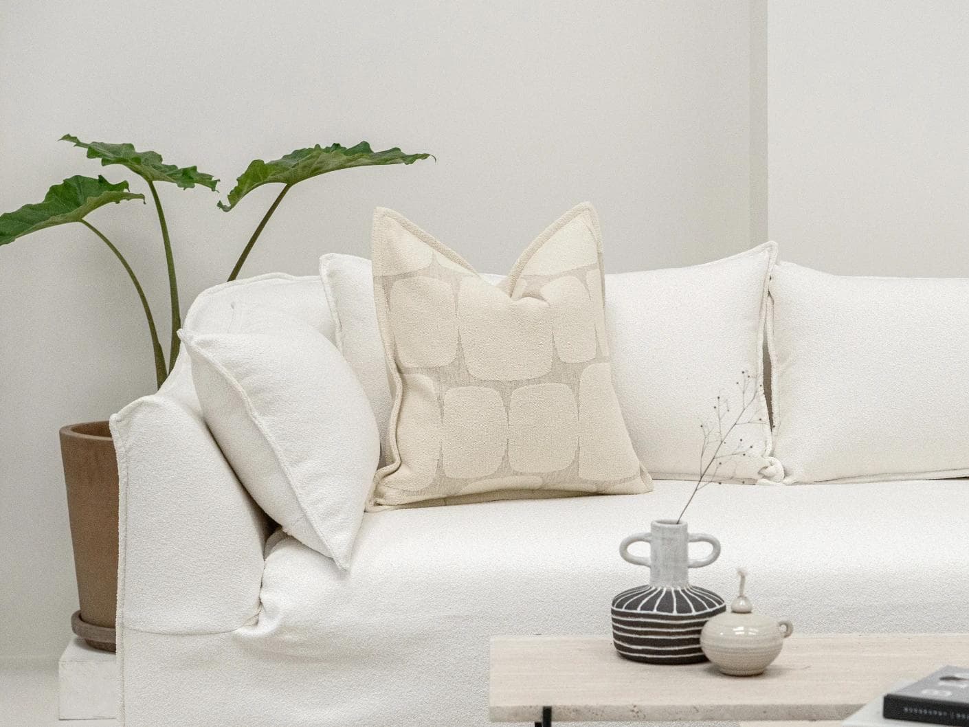 Kyomi Klimt cushion in ivory and beige, shown in a lifestyle front view as image 4