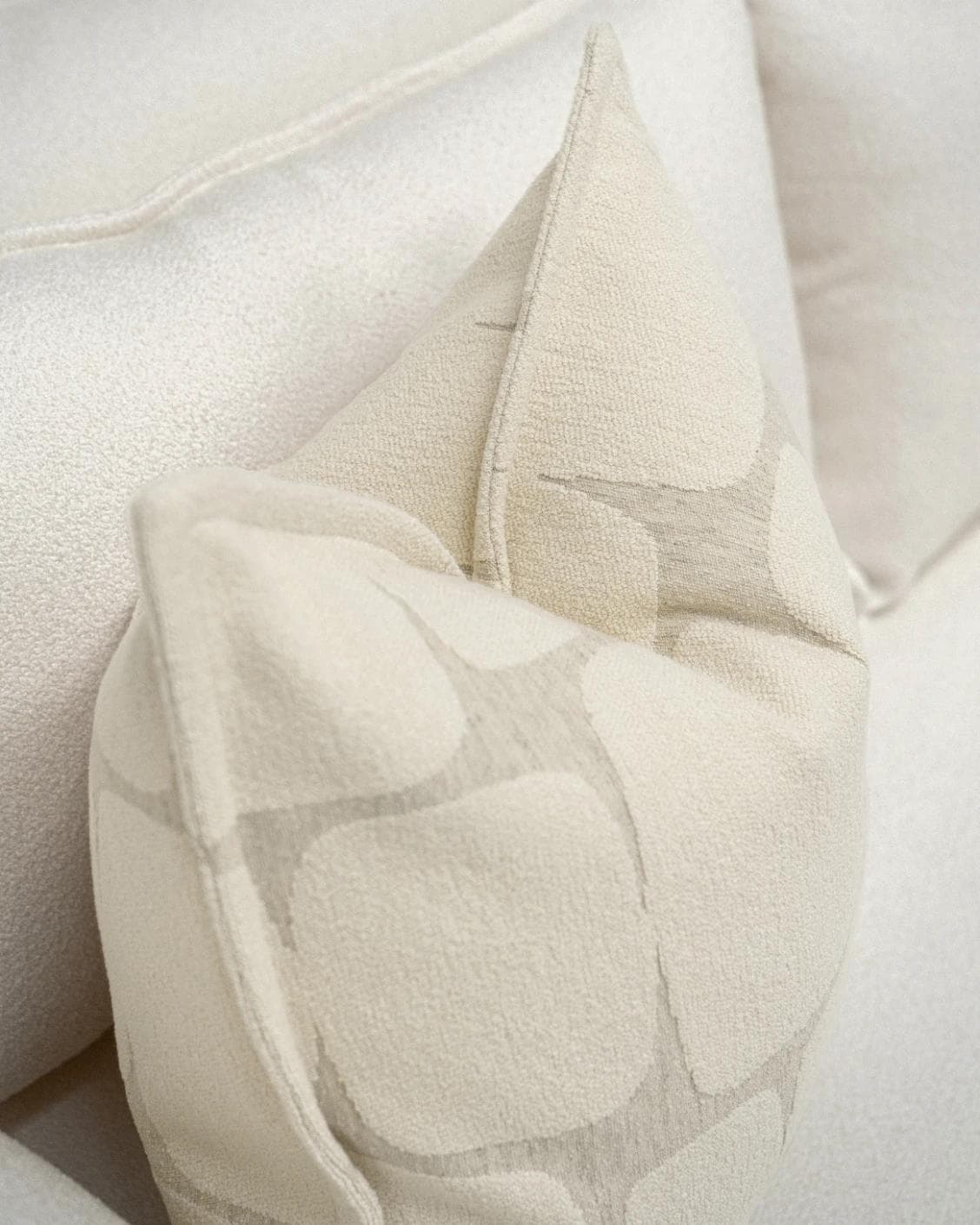 Kyomi Klimt cushion in ivory and beige, shown in a lifestyle top view as image 5