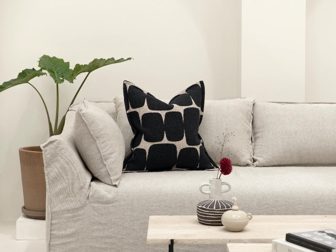 Kyomi Steele cushion in charcoal, shown in a lifestyle front view as image 4