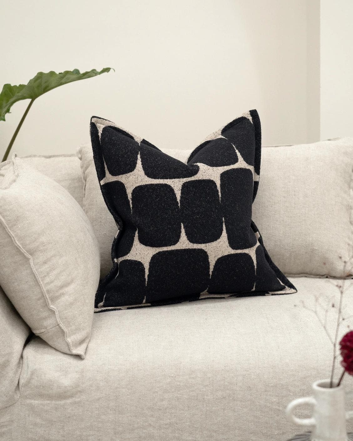 Kyomi Steele cushion in charcoal, shown in a lifestyle front view as image 2
