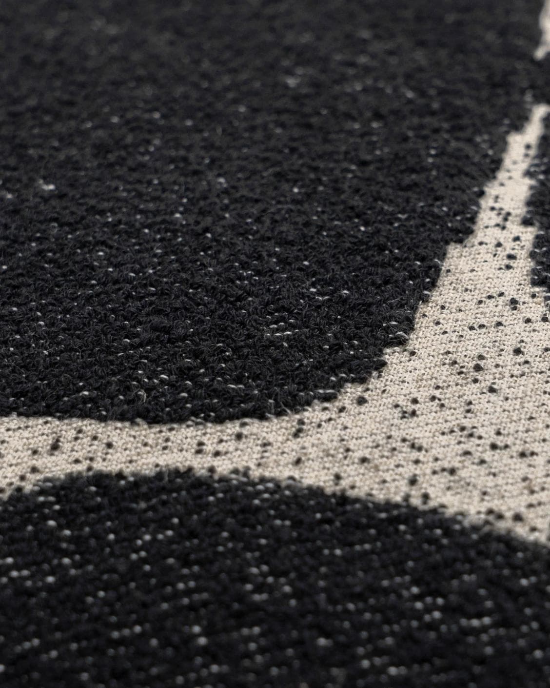 Kyomi Steele cushion in charcoal, shown in a product close-up as image 6