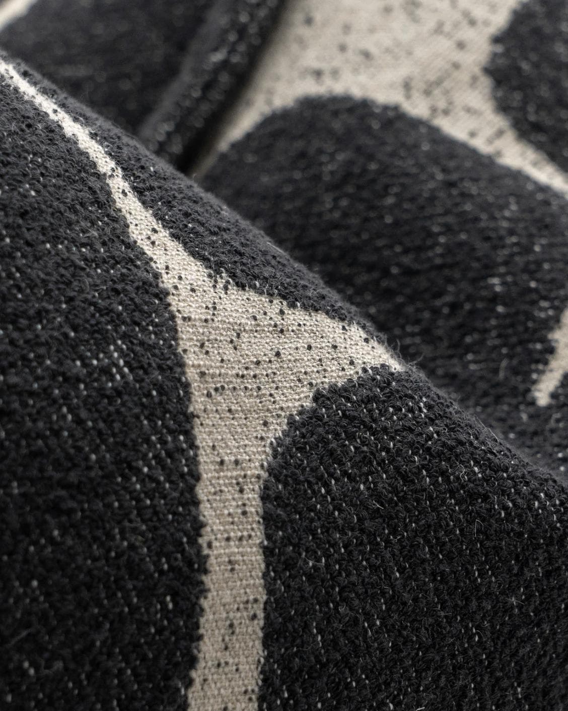 Kyomi Steele cushion in charcoal, shown in a product close-up as image 8