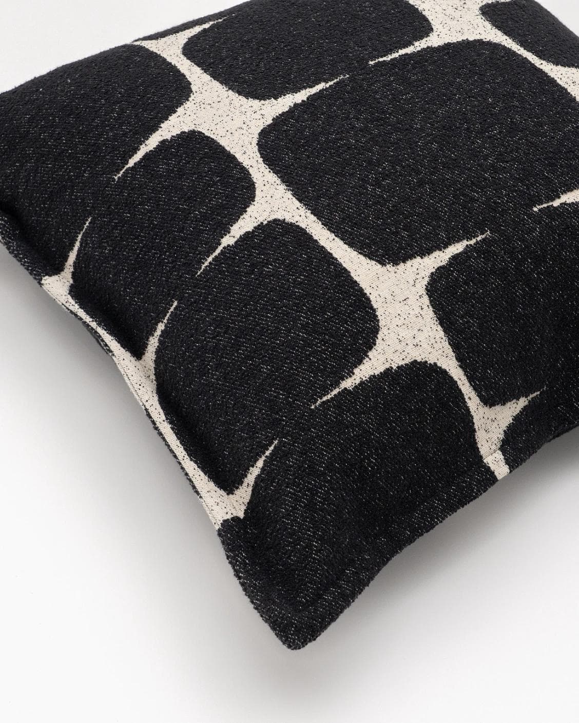 Kyomi Steele cushion in charcoal, shown in a product top view as image 9