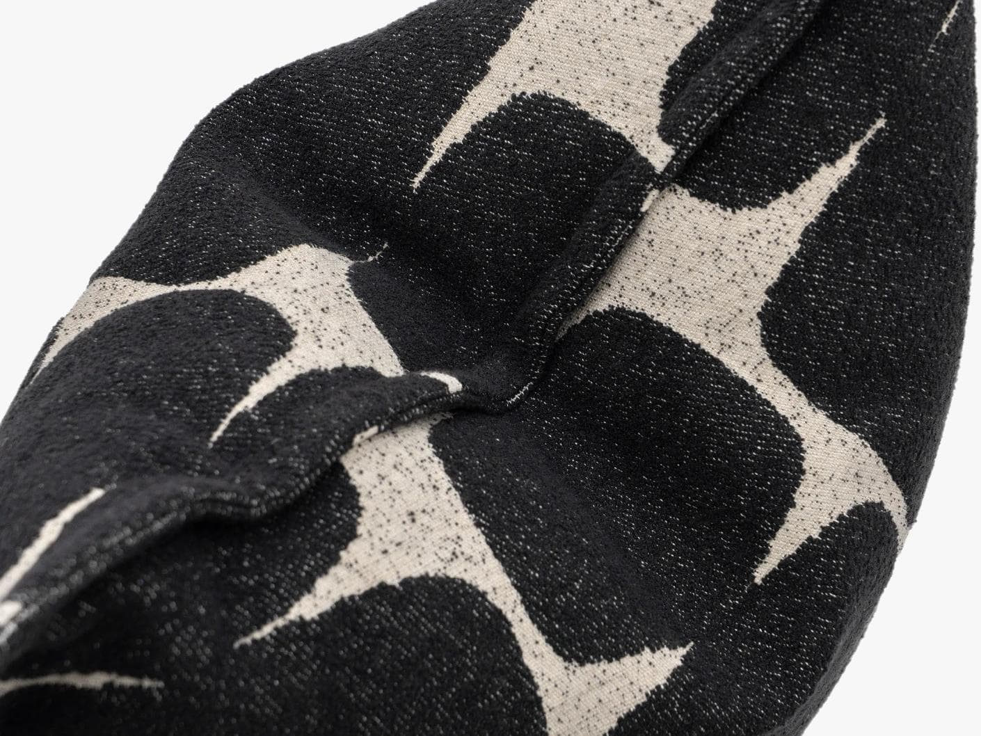 Kyomi Steele cushion in charcoal, shown in a product top view as image 10