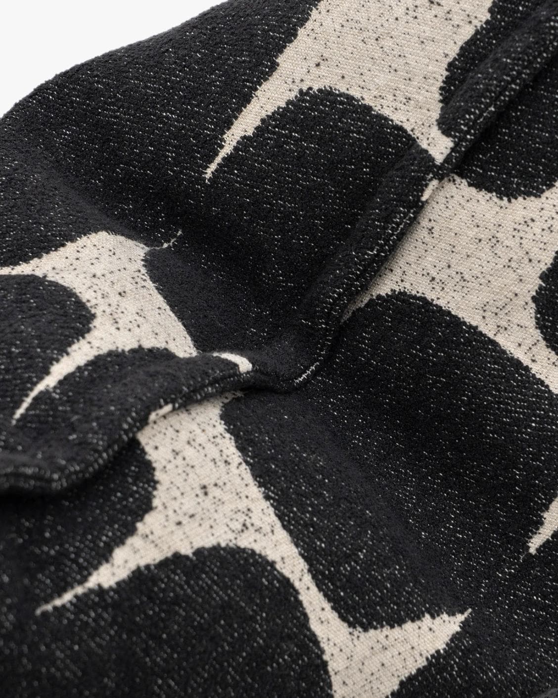 Kyomi Steele cushion in charcoal, shown in a product top view as image 10