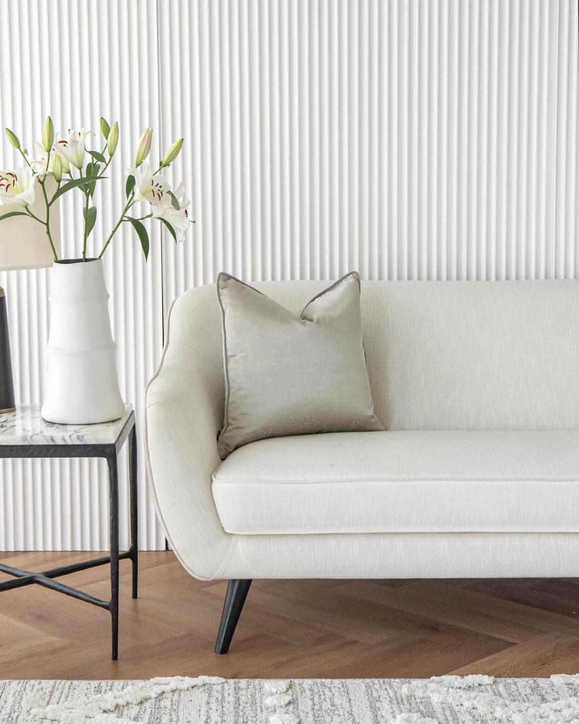 Lainie Laurent cushion in silver, shown in a lifestyle front view as image 4