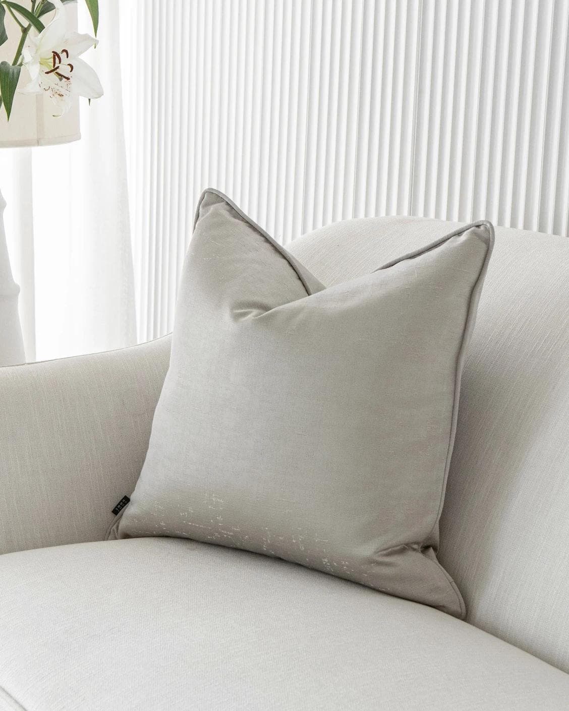 Lainie Laurent cushion in silver, shown in a lifestyle front view as image 2