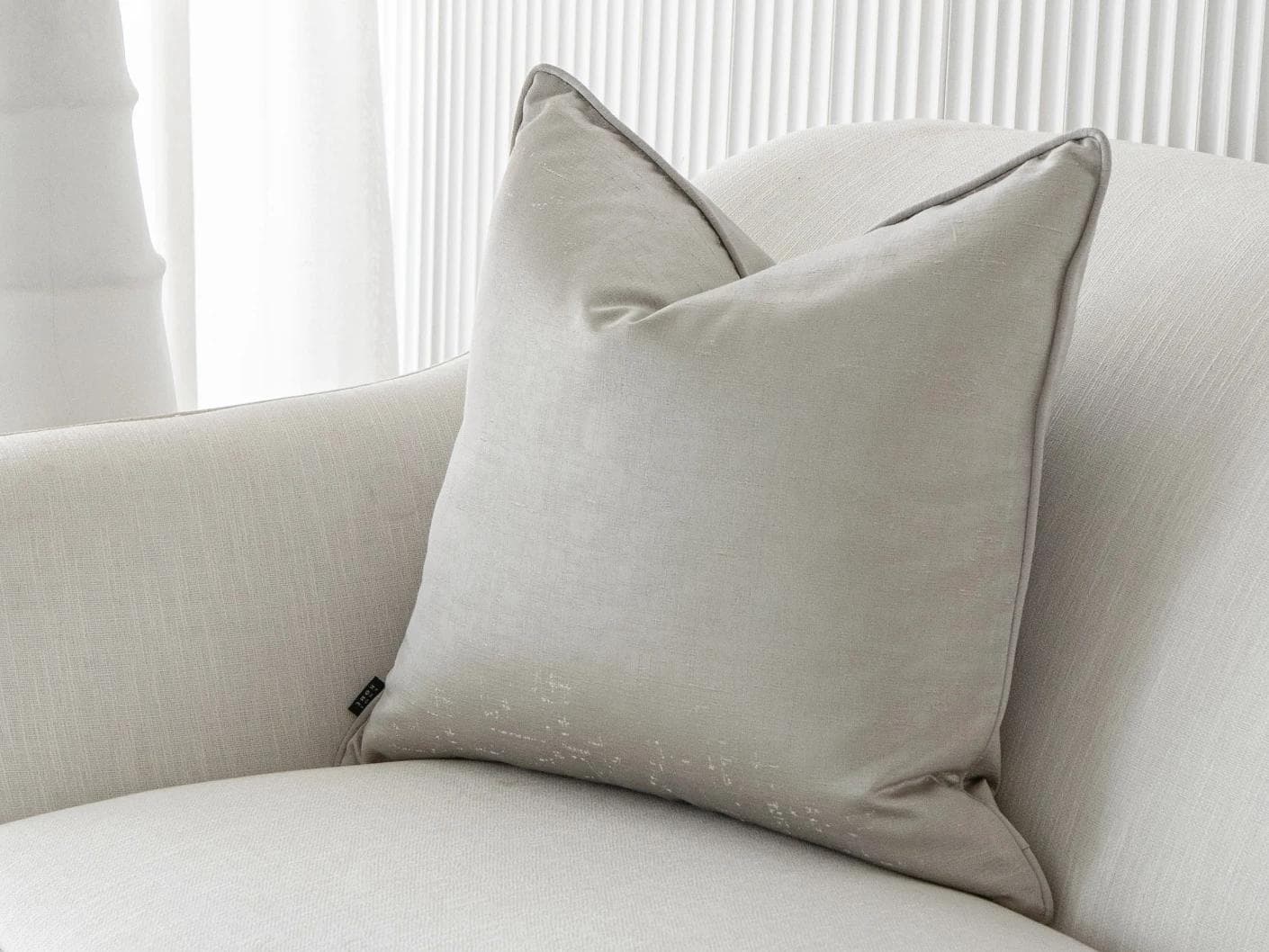 Lainie Laurent cushion in silver, shown in a lifestyle front view as image 2