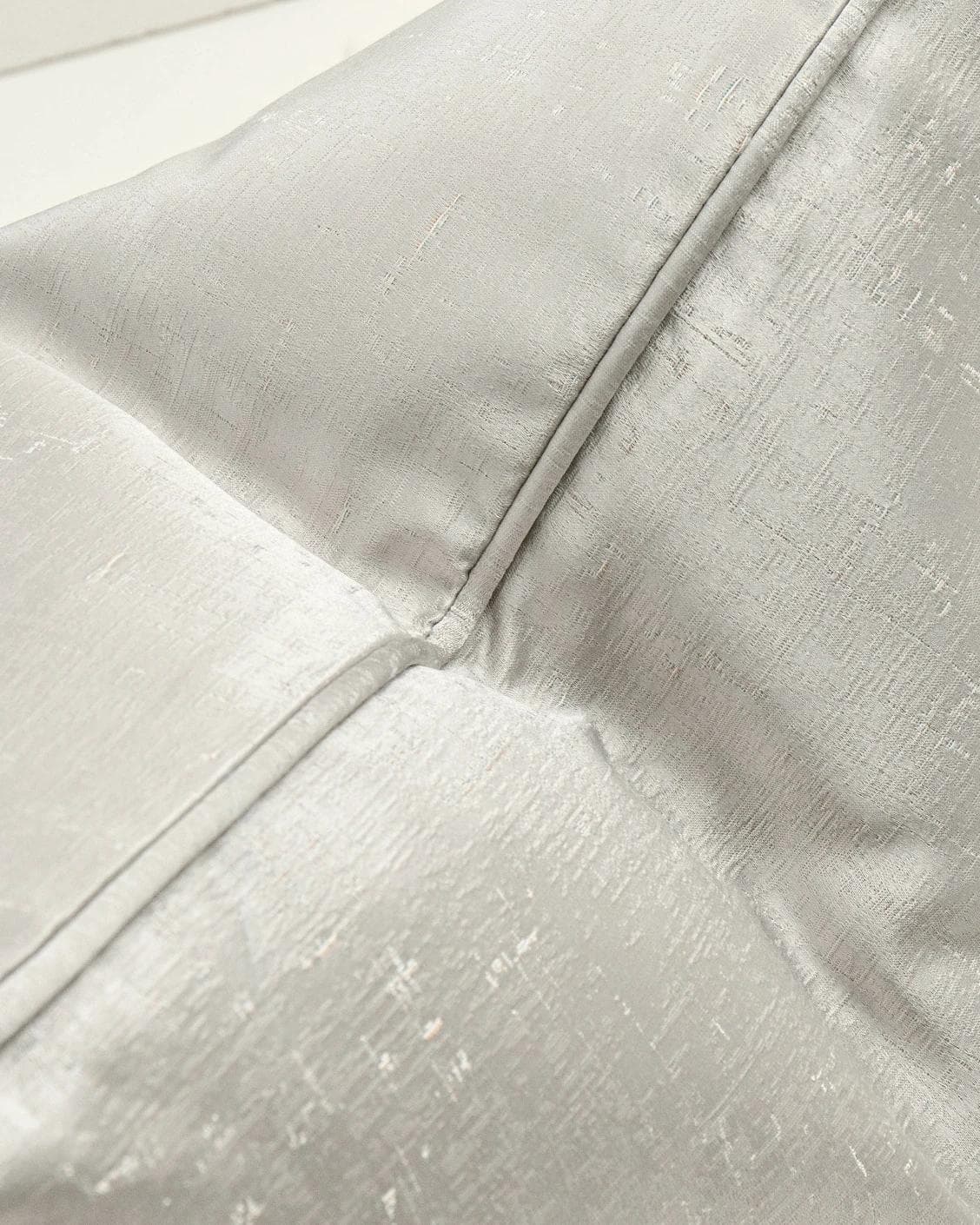 Lainie Laurent cushion in silver, shown in a lifestyle top view as image 6