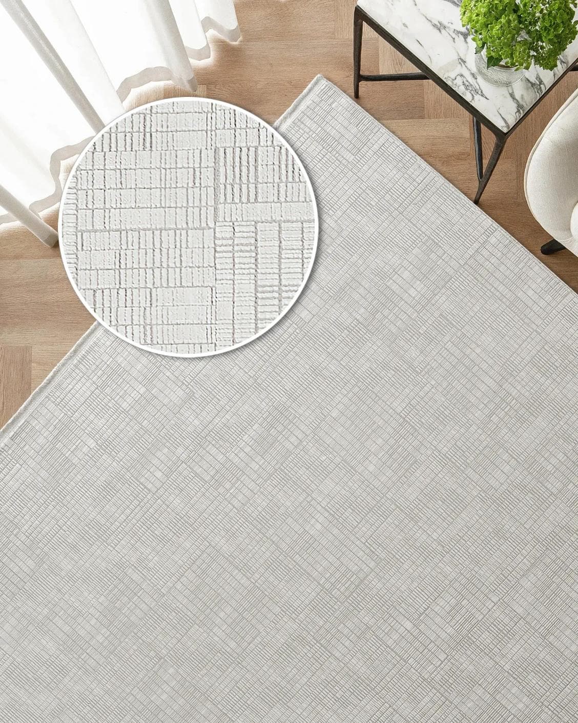Laino Ashton carpet in ivory and grey, shown in a lifestyle top view as image 2
