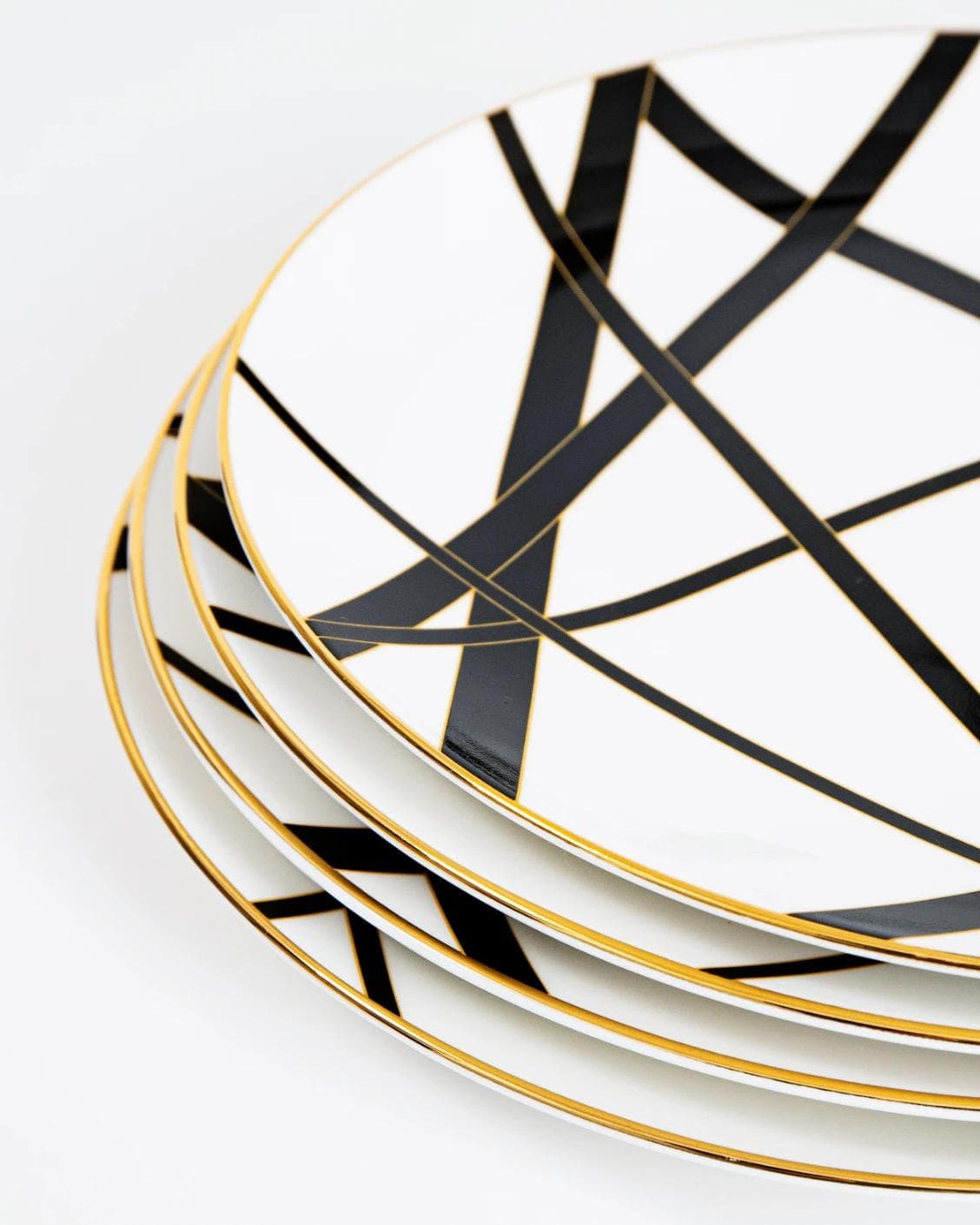 Leanna Viktoria plates in white, black and gold, shown in a product close-up as image 7