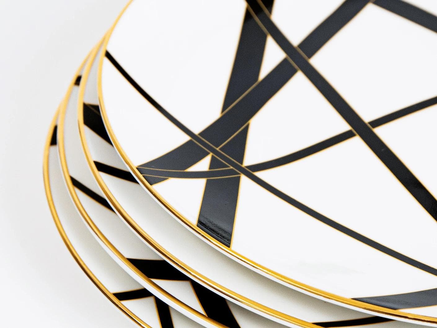Leanna Viktoria plates in white, black and gold, shown in a product close-up as image 7