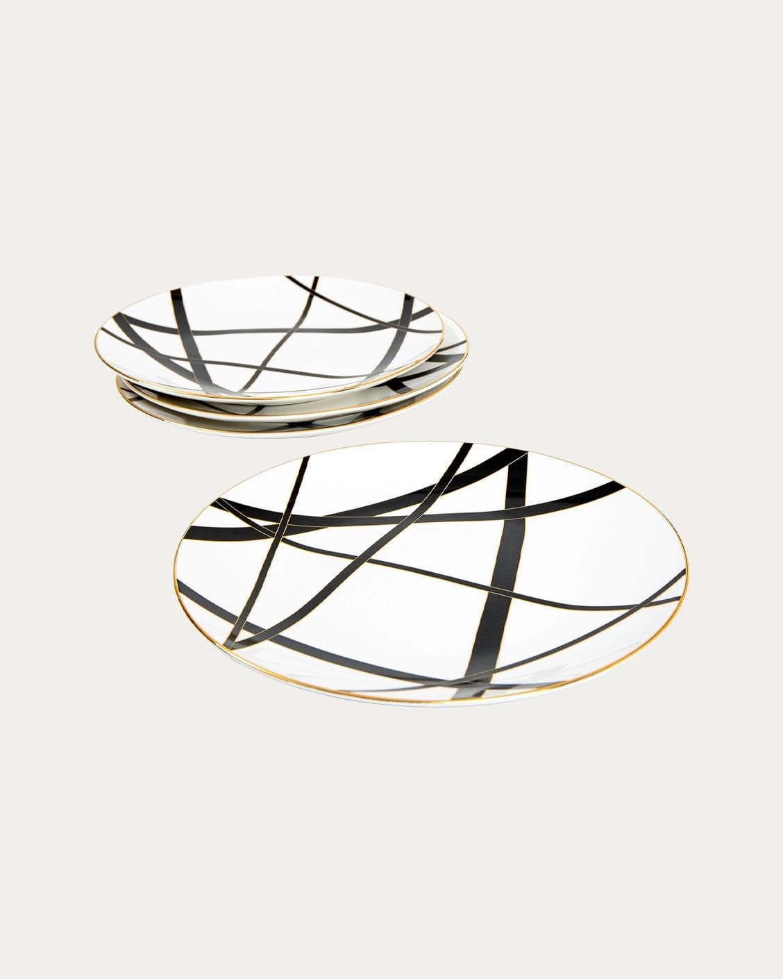 Leanna Viktoria plates in white, black and gold, shown in a product front view as image 1