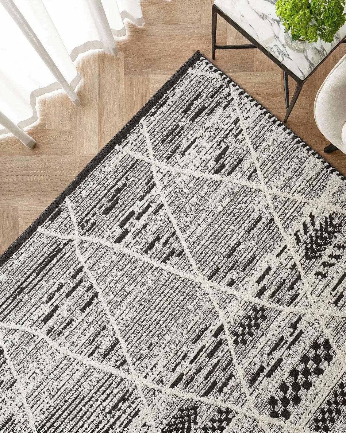 Leila Ebony carpet in charcoal and white, shown in a lifestyle top view as image 2