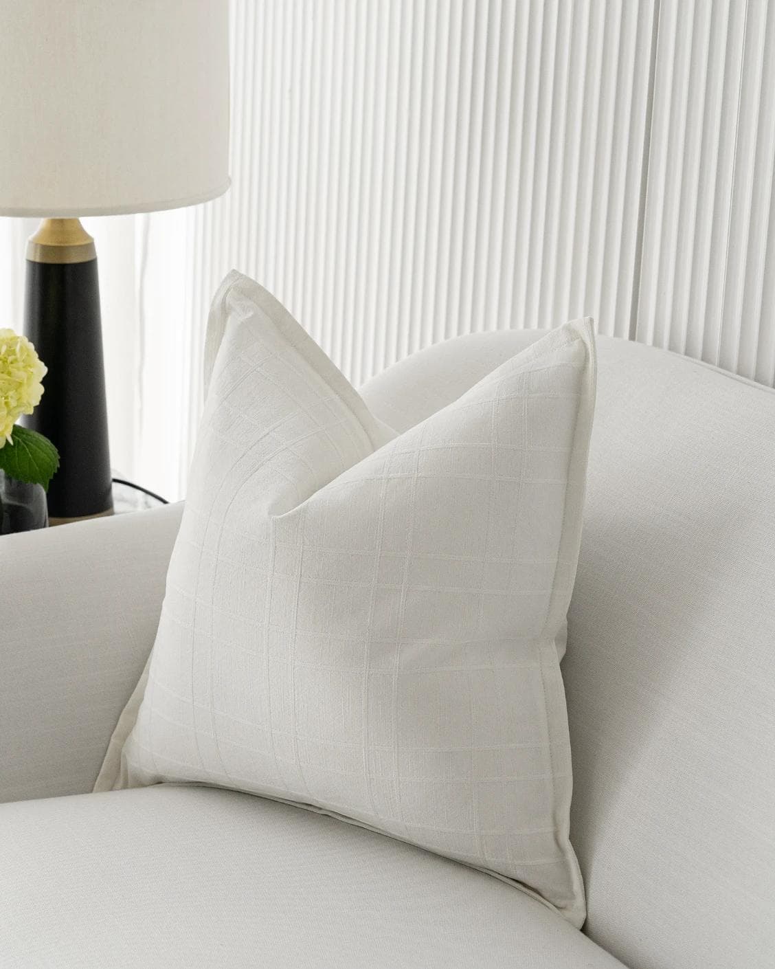 Lenora Bianca cushion in white, shown in a lifestyle front view as image 4