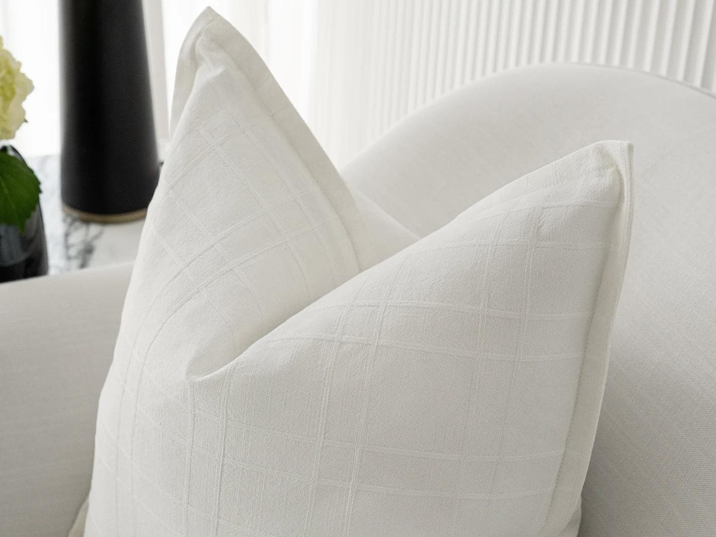 Lenora Bianca cushion in white, shown in a lifestyle right view as image 5