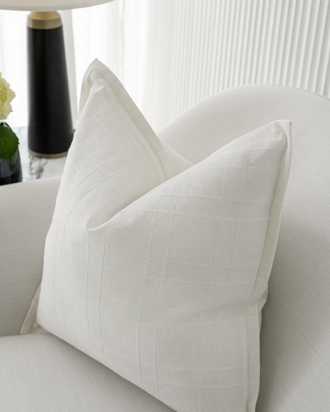Lenora Bianca cushion in white, shown in a lifestyle right view as image 5