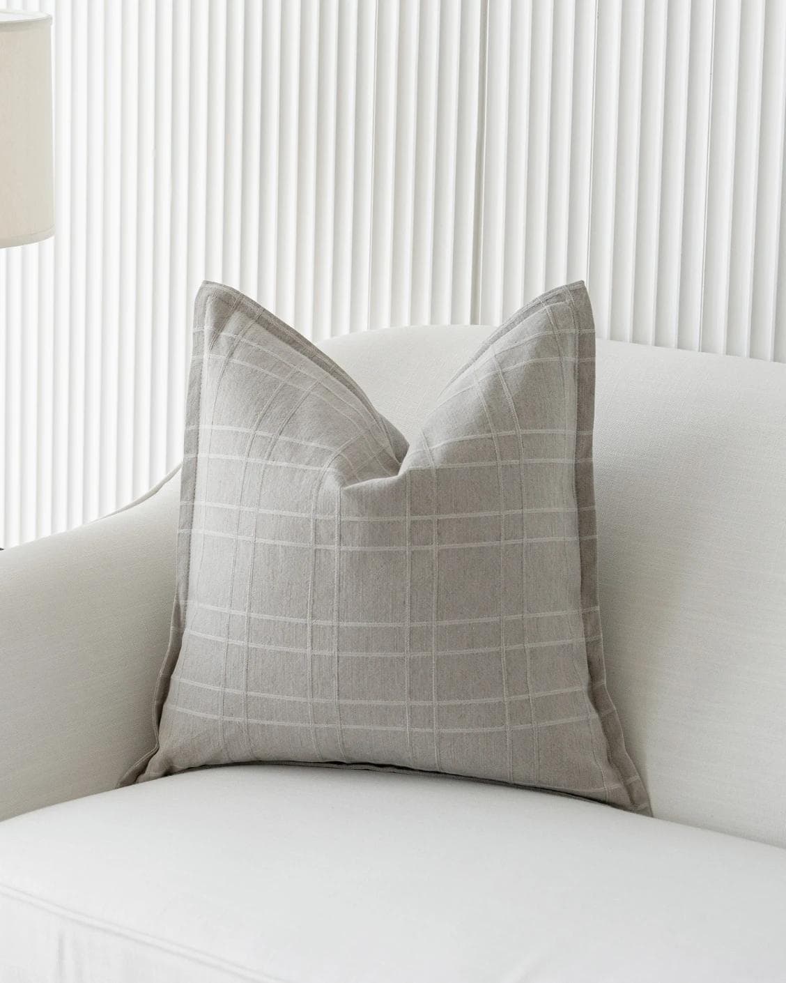 Lenora Laurent cushion in grey, shown in a lifestyle front view as image 2