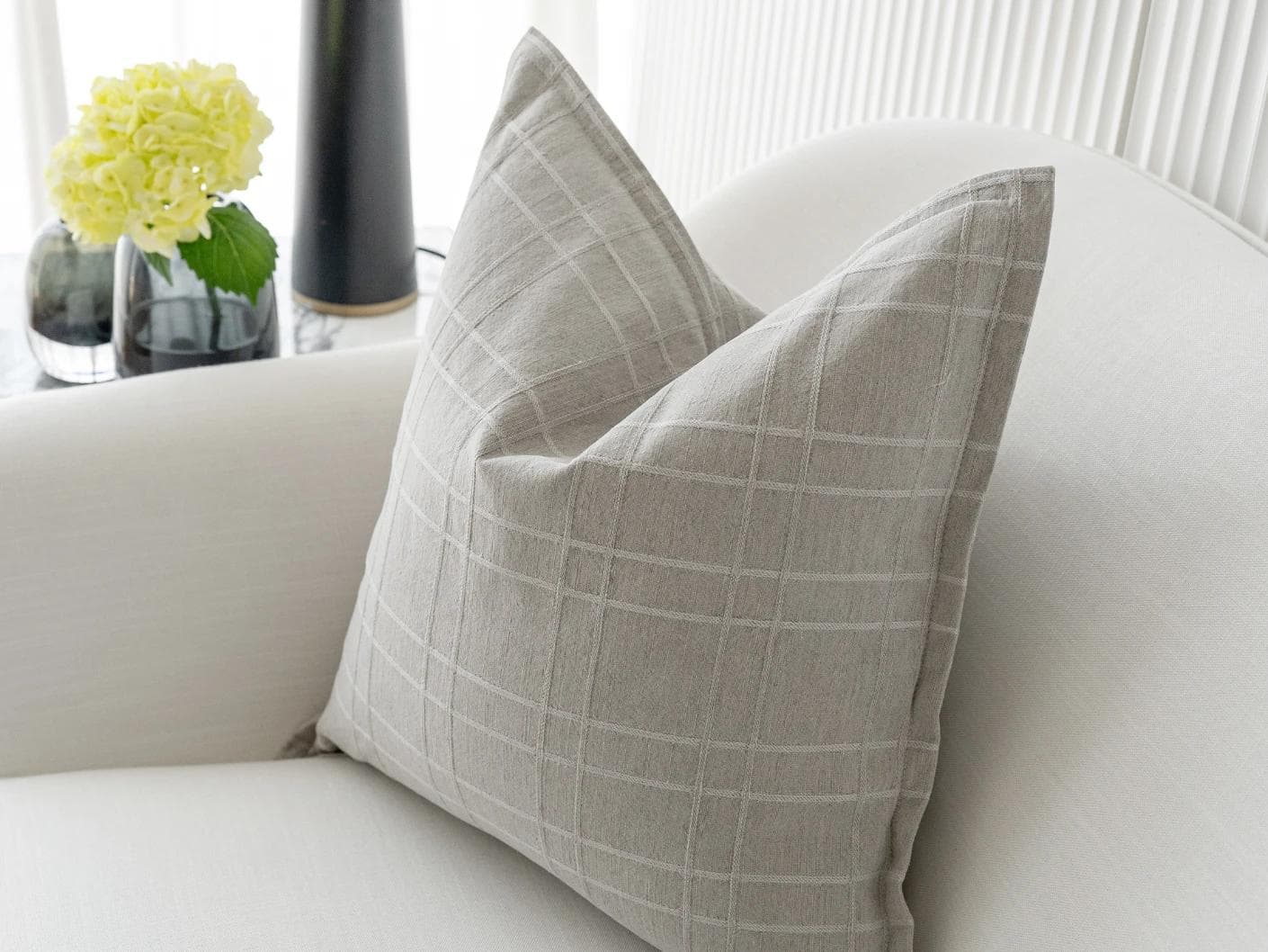 Lenora Laurent cushion in grey, shown in a lifestyle right view as image 5