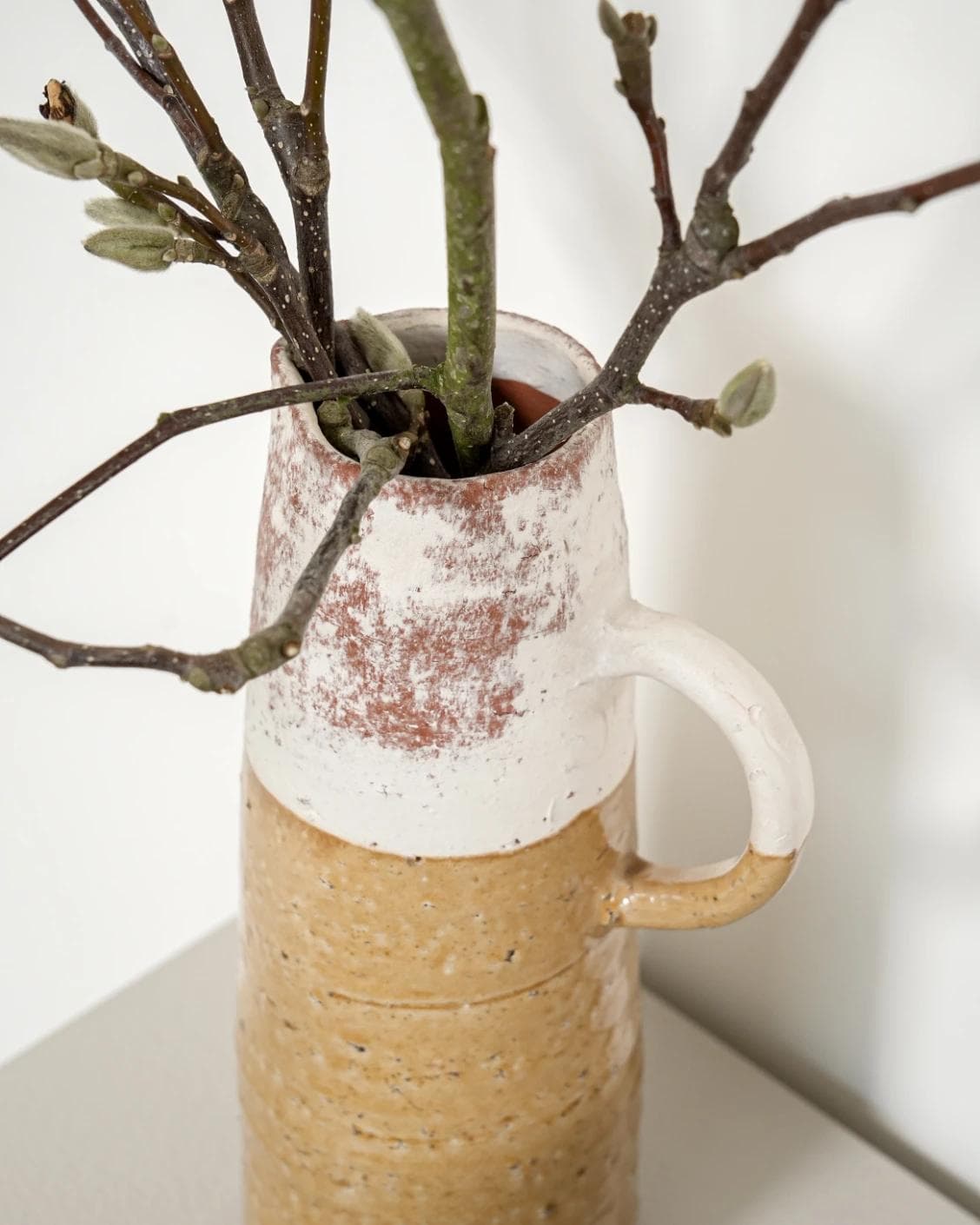 Leva Terra vases in white and beige, shown in a lifestyle close-up top view as image 4