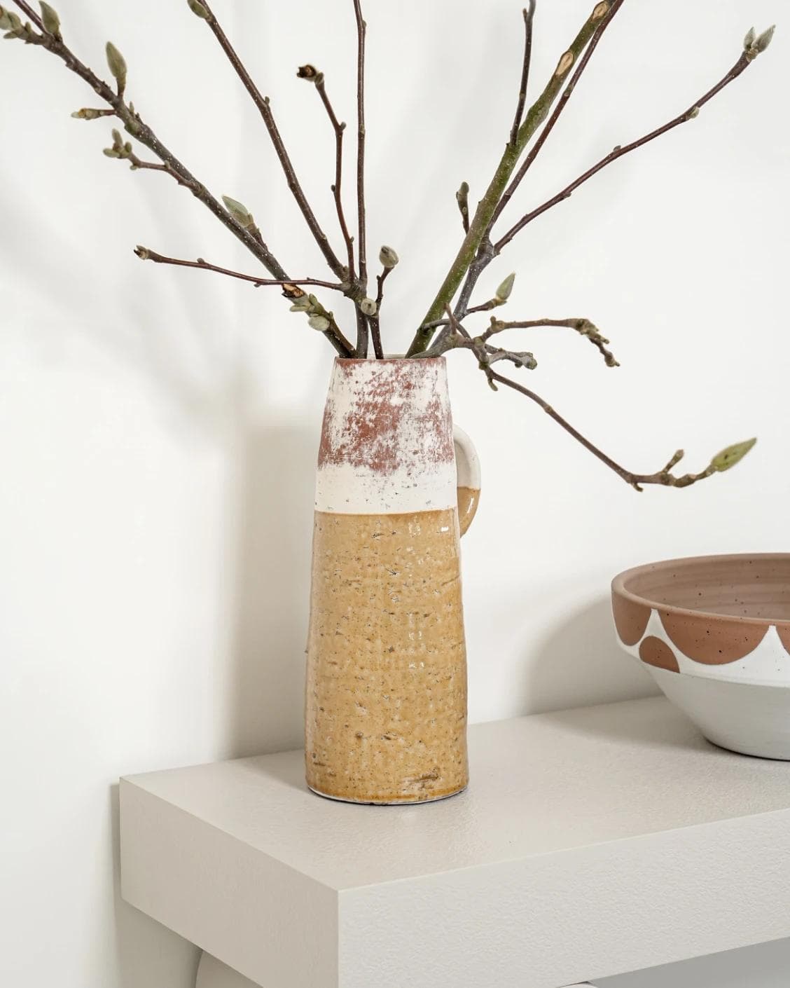 Leva Terra vases in white and beige, shown in a lifestyle front view as image 2
