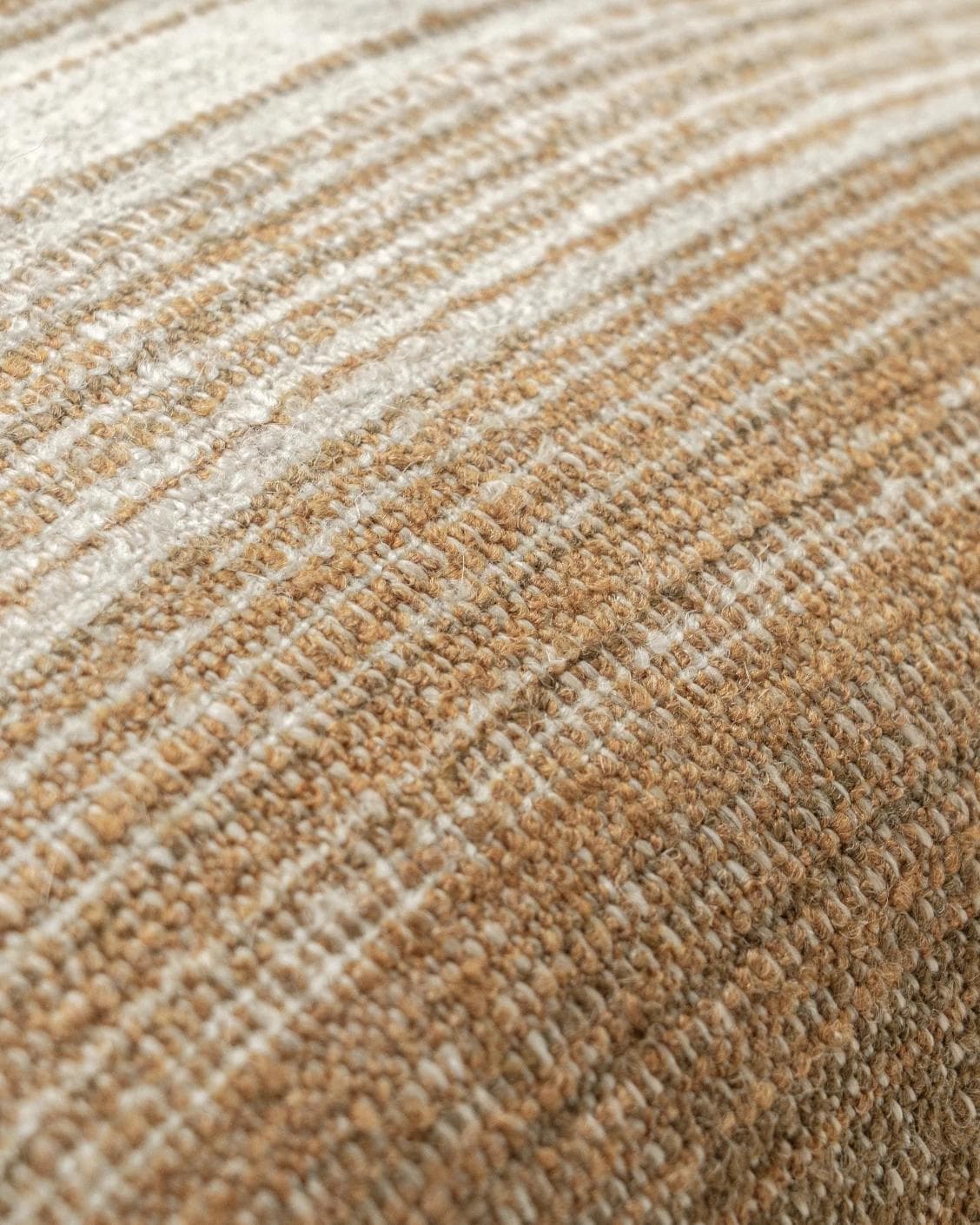 Lia Ember cushion in brown, shown in a product close-up as image 6
