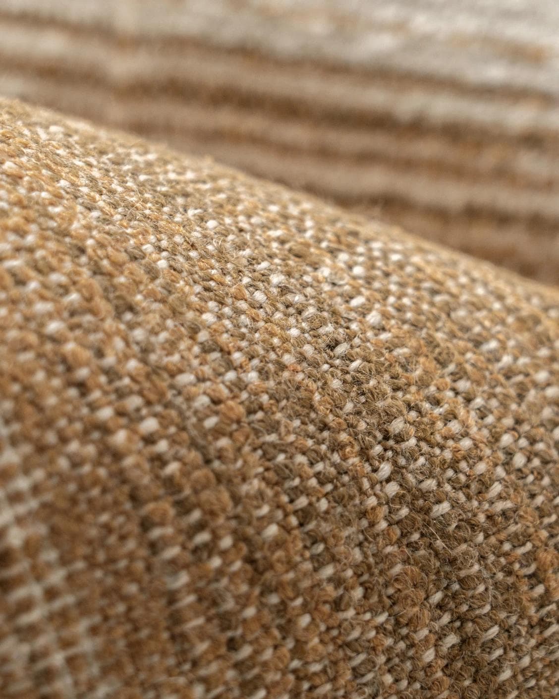 Lia Ember cushion in brown, shown in a product close-up as image 7