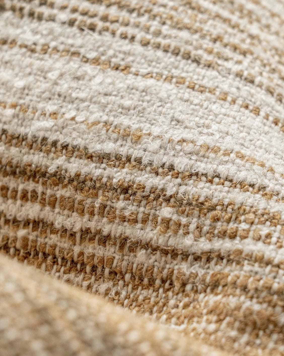 Lia Ember cushion in brown, shown in a product close-up as image 8