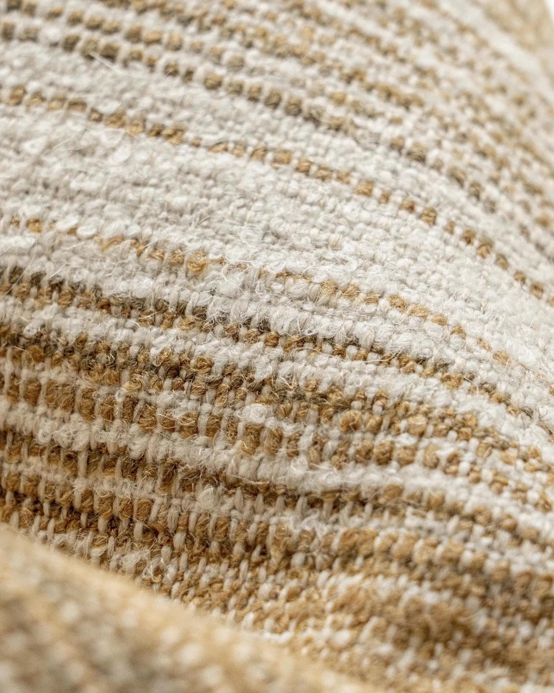 Lia Ember III cushion in cream, shown in a product close-up top view as image 9