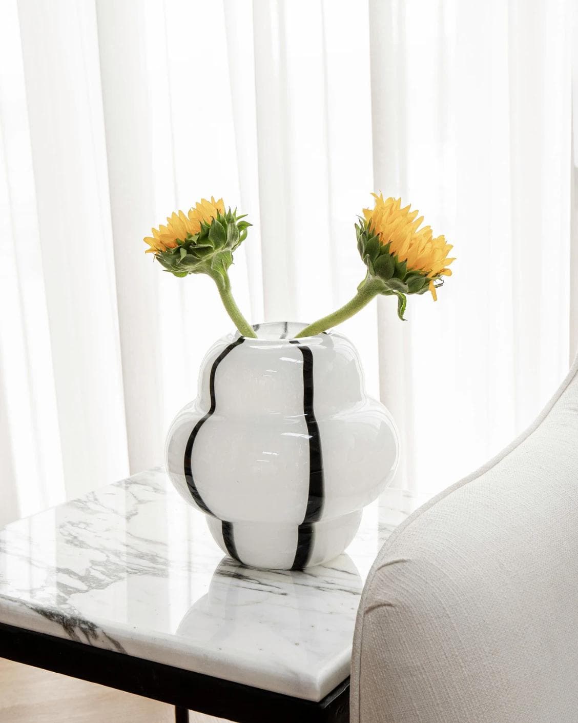 Linea Storms vases in black and ivory, shown in a lifestyle front view as image 2
