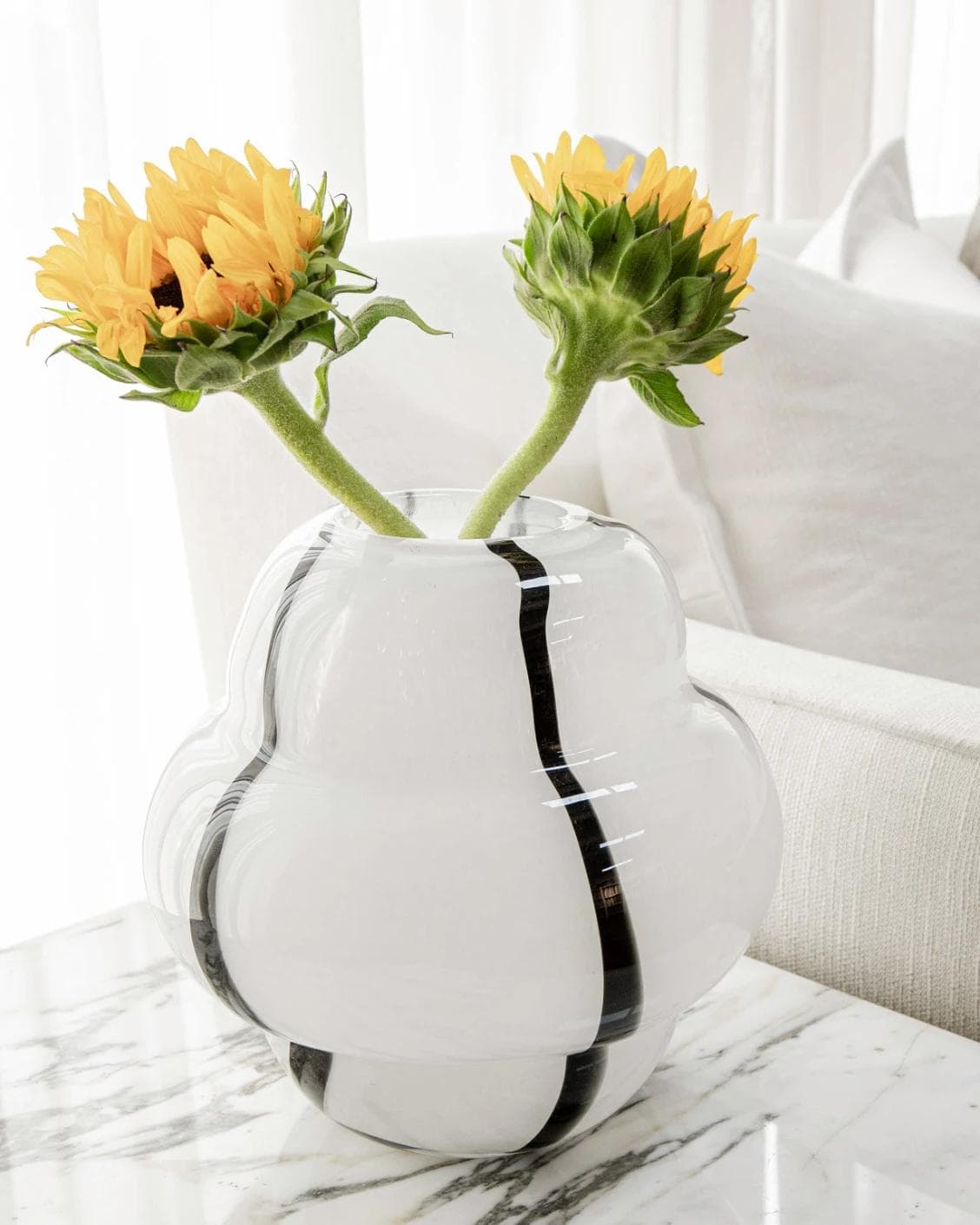 Linea Storms vases in black and ivory, shown in a lifestyle left view as image 6