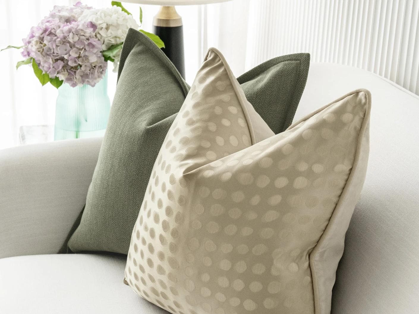 Lirika Bundle cushion in black, green, beige and gold, shown in a lifestyle right view as image 5