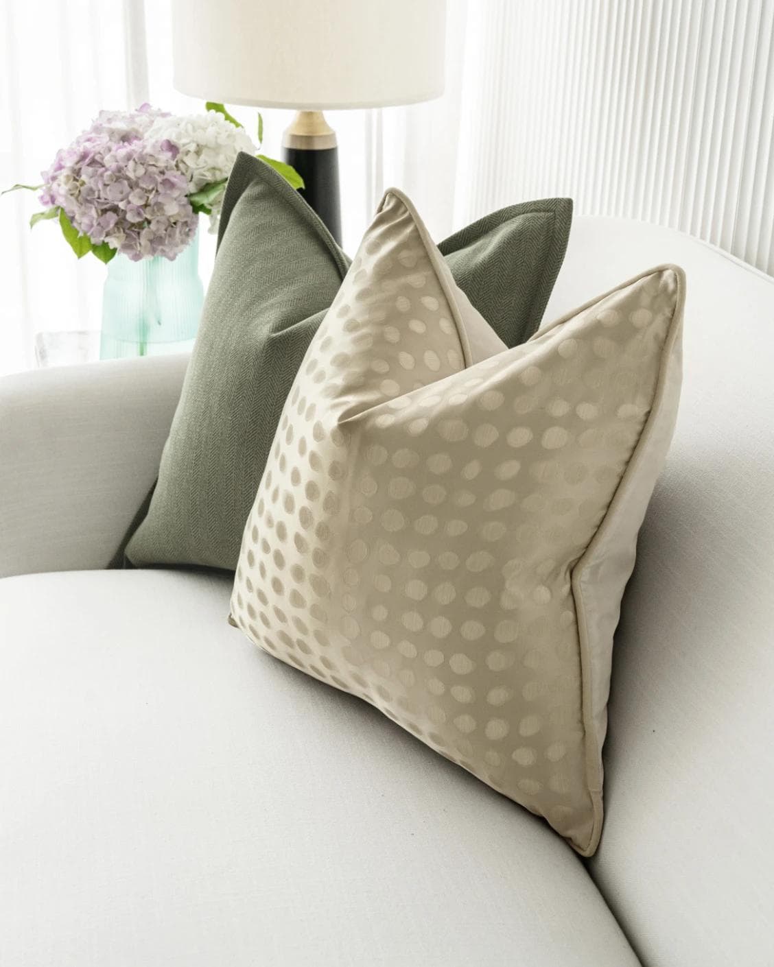 Lirika Bundle cushion in black, green, beige and gold, shown in a lifestyle right view as image 5