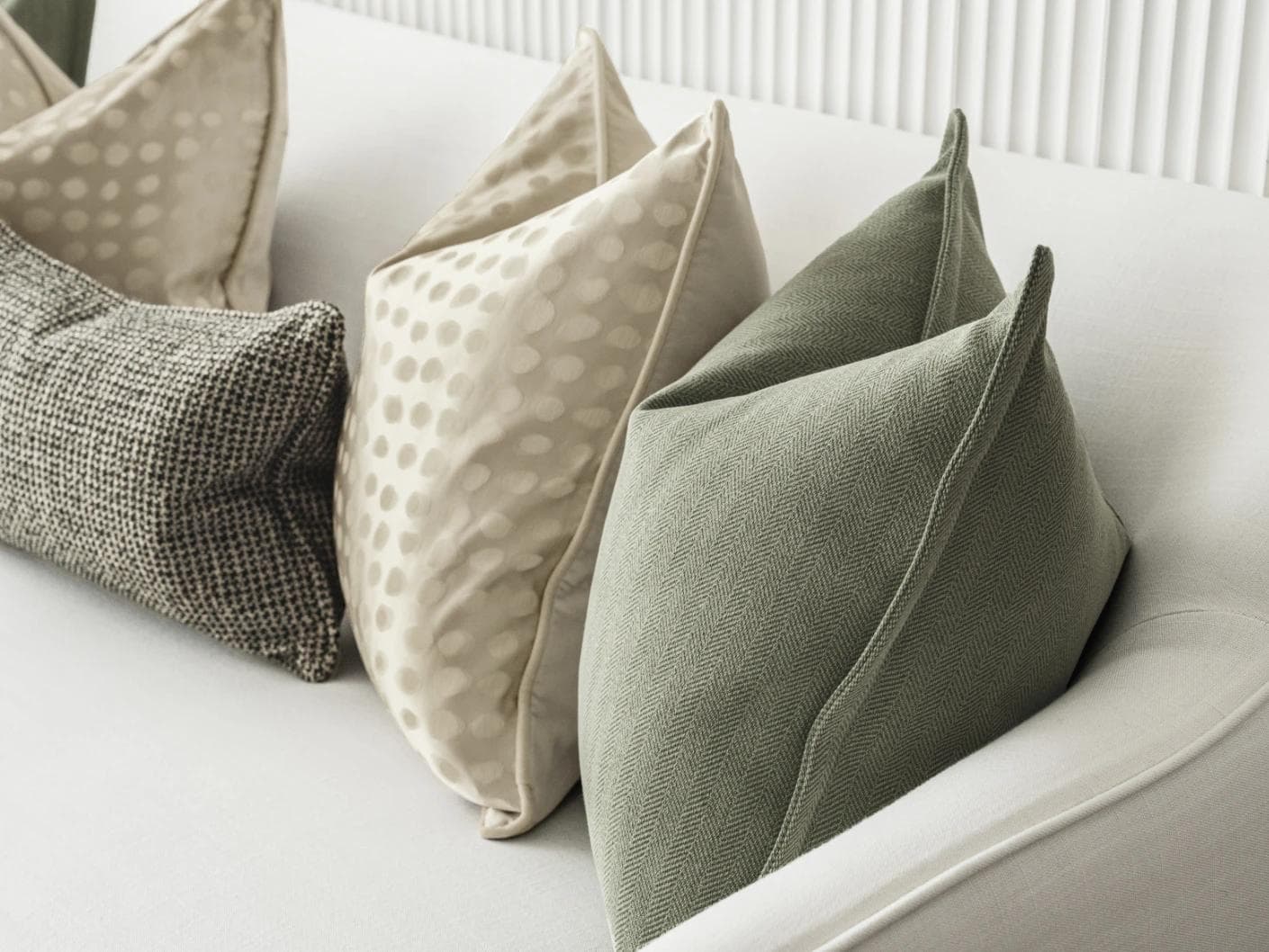 Lirika Bundle cushion in black, green, beige and gold, shown in a product right view as image 8