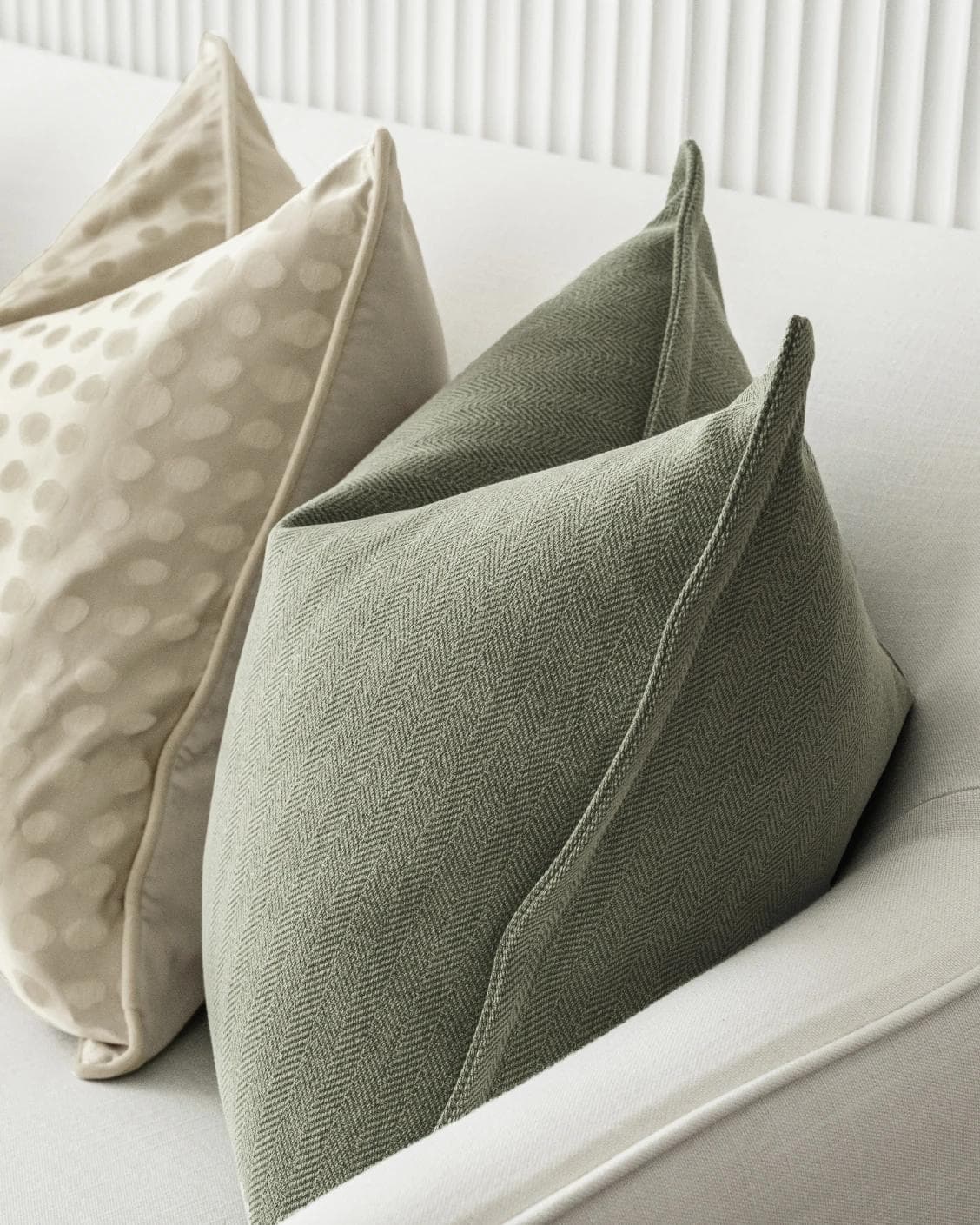 Lirika Bundle cushion in black, green, beige and gold, shown in a product right view as image 8