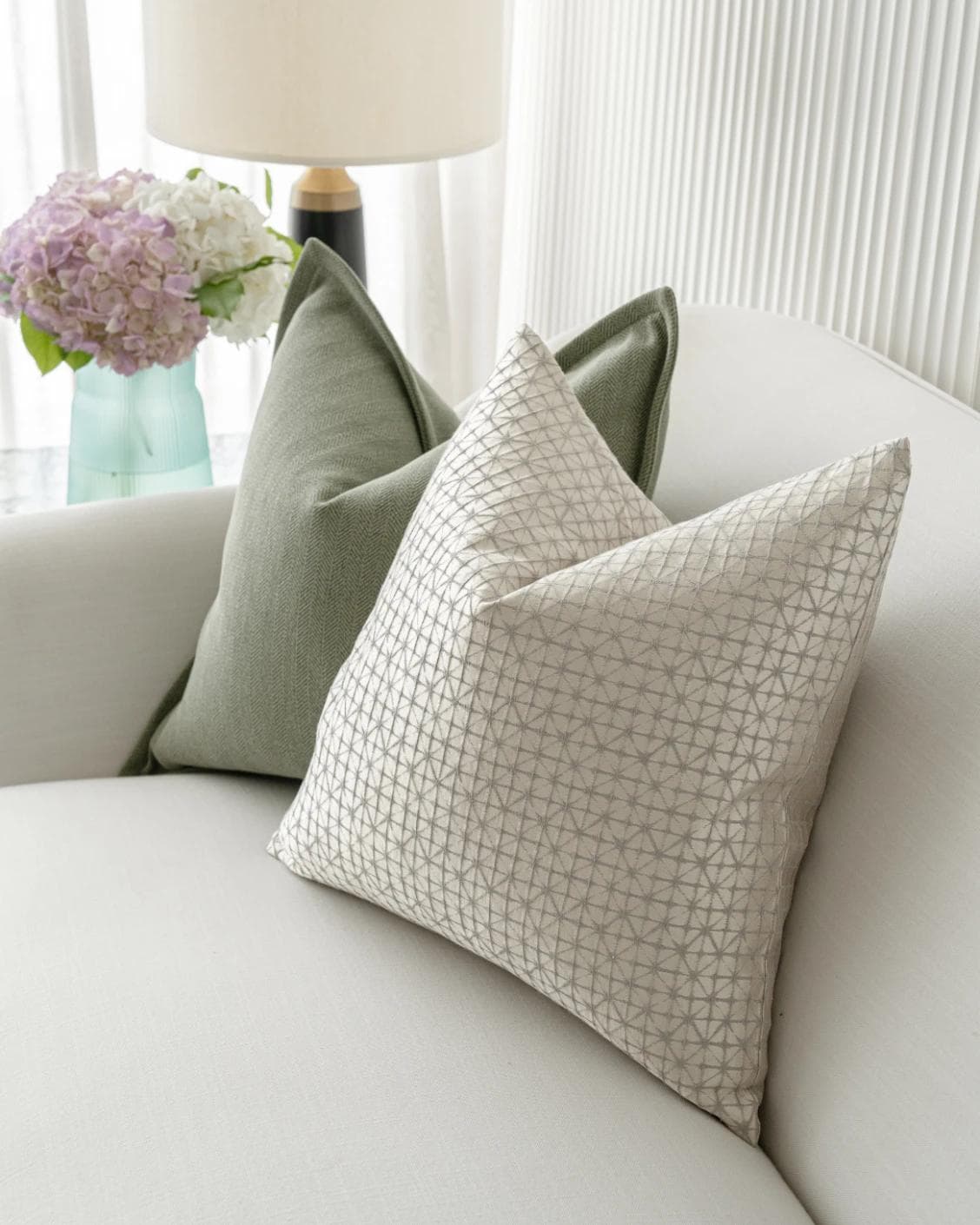 Lloyd Bundle cushion in silver, white and green, shown in a lifestyle top view as image 5