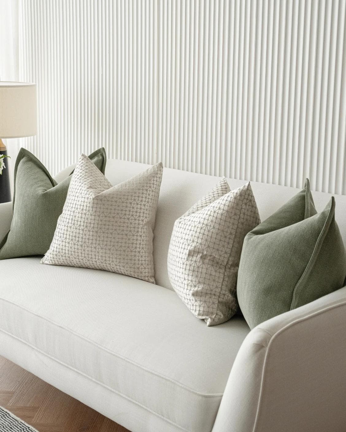Lloyd Bundle cushion in silver, white and green, shown in a product right view as image 6