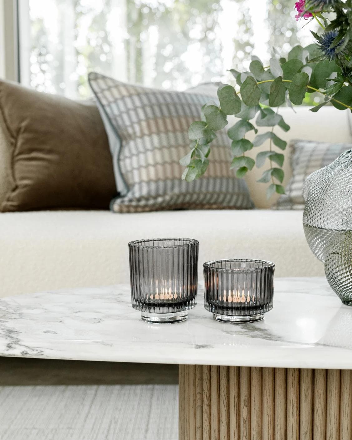 Loucille Storms candle holders in grey, shown in a lifestyle front view as image 2